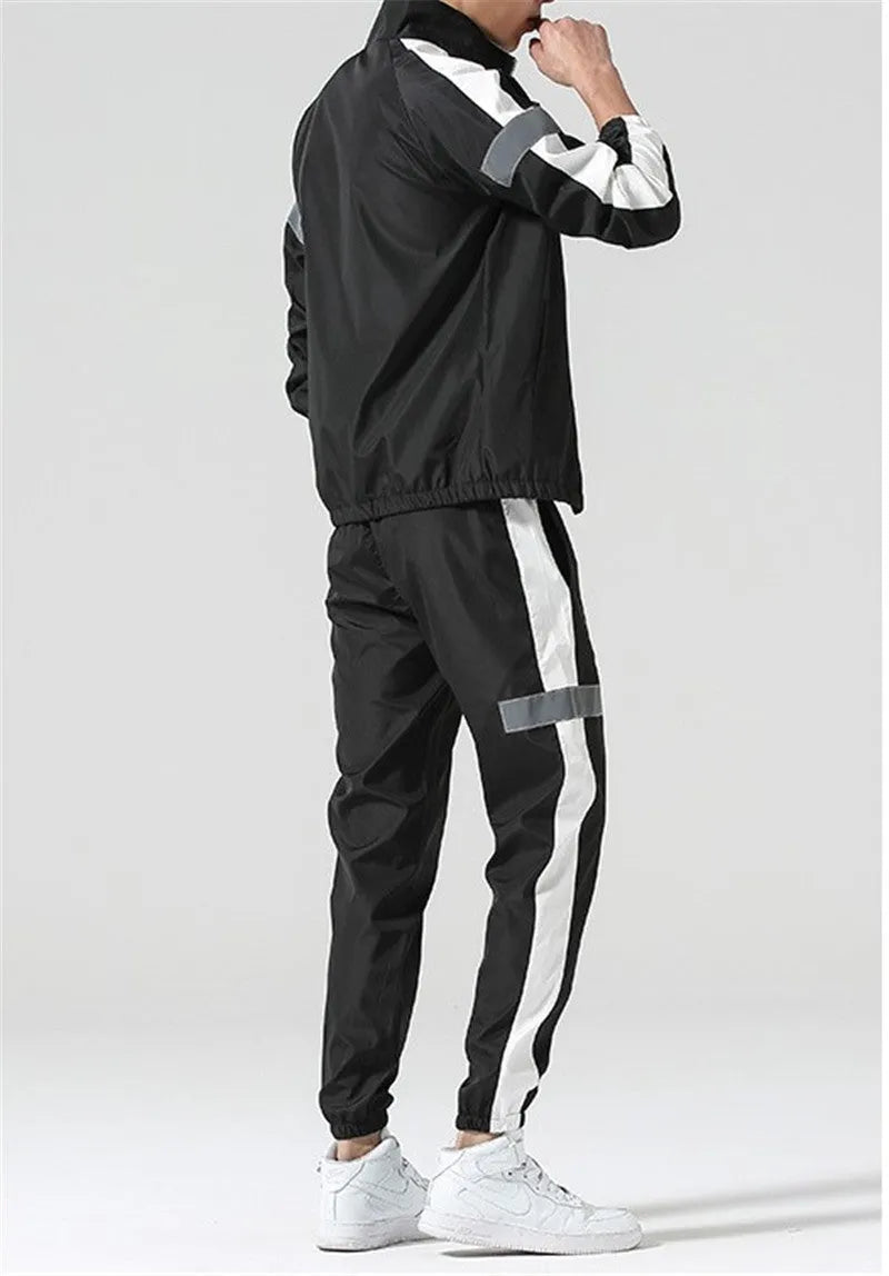 Reflective track suit in black polyester with reflective strips, front view