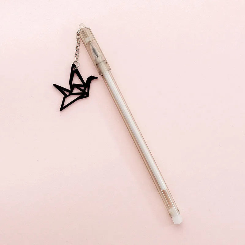 White and black gel pen with removable paper crane and rabbit pendant charms on a 17cm plastic body