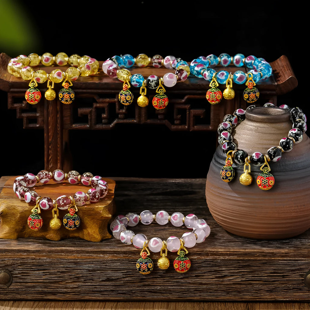 Handmade glass bracelet with swallowing gold beast design and 10mm heart-shaped beads in fluorescent glaze