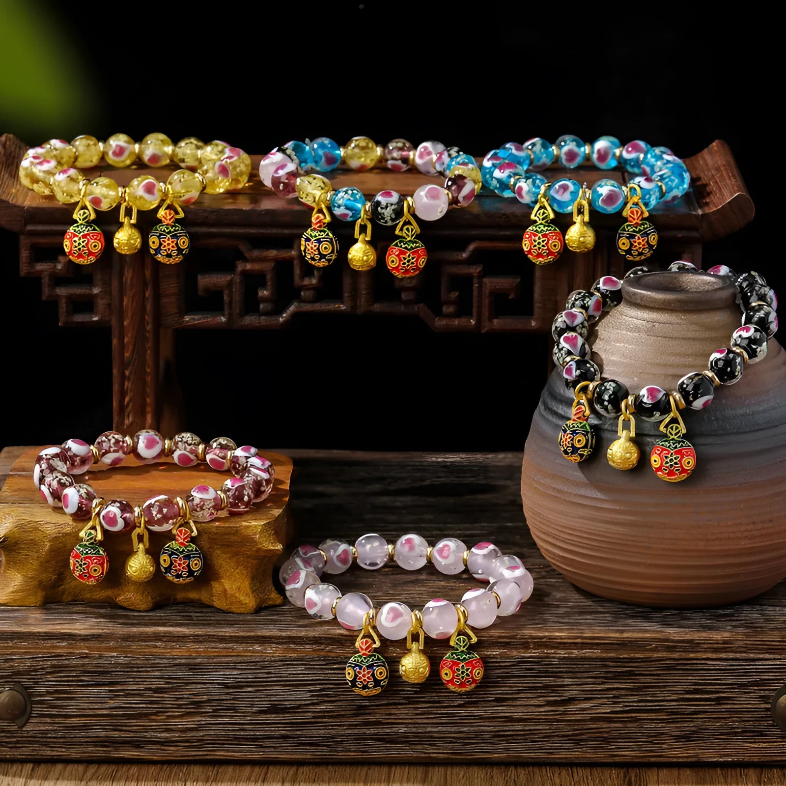 Handmade glass bracelet with swallowing gold beast design and 10mm heart-shaped beads in fluorescent glaze