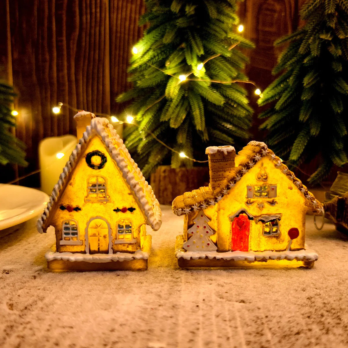 Christmas resin small house micro landscape with warm LED glow on tabletop