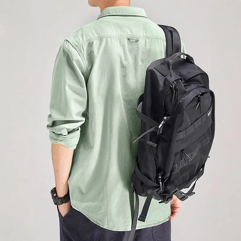 Man's loose fitting long sleeve cardigan shirt in light grey, black, khaki, or green.