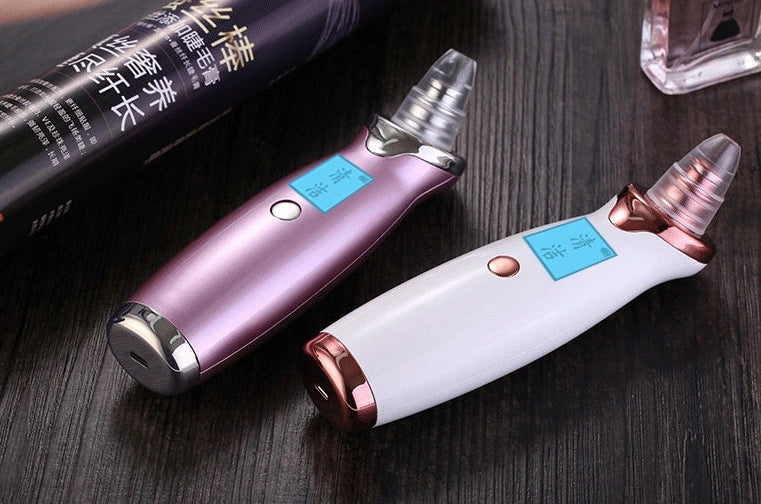 Blackhead vacuum cleaner with digital display showing 53KPa suction power and rose gold finish