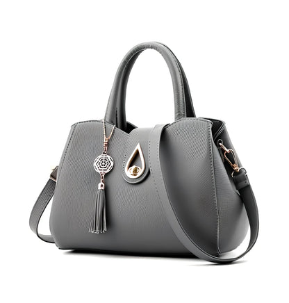 Women's litchi pattern PU leather tote bag with zipper closure and adjustable shoulder strap showing internal pockets