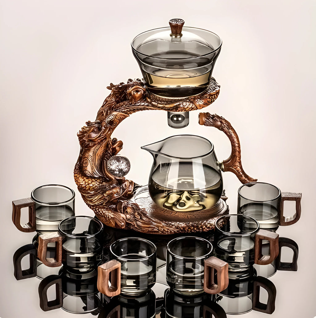 Green gray walnut glass automatic tea set with bowl, base, and fair cup on a table