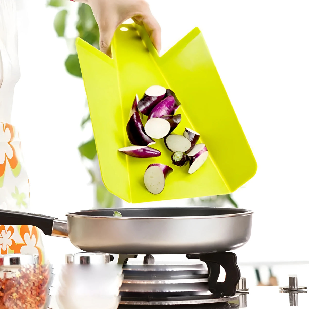 Green folding plastic cutting board 37.5cm x 21cm with non-slip texture and hanging hole on a kitchen counter