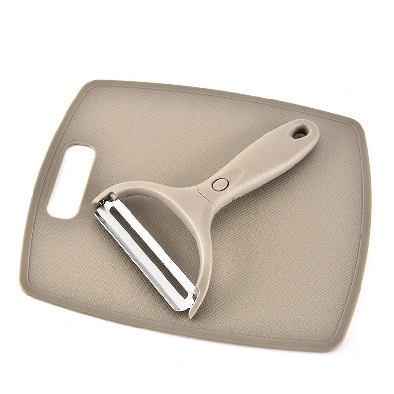 Green multi-function kitchen tool set with stainless steel blades for peeling, cutting and shaving on wheat straw chopping board