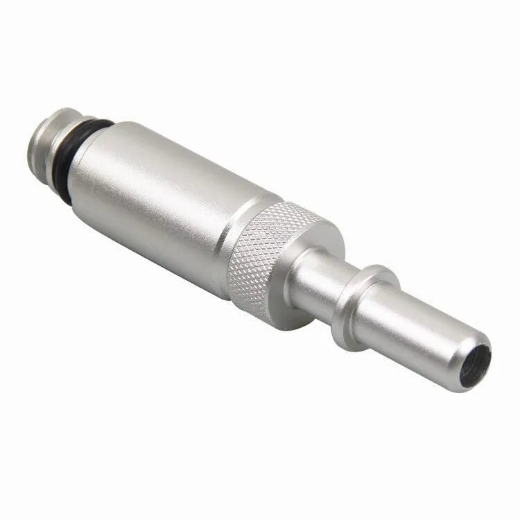 Silver metal VAS6262-9 transmission oil refueling adapter tool on a workshop bench.