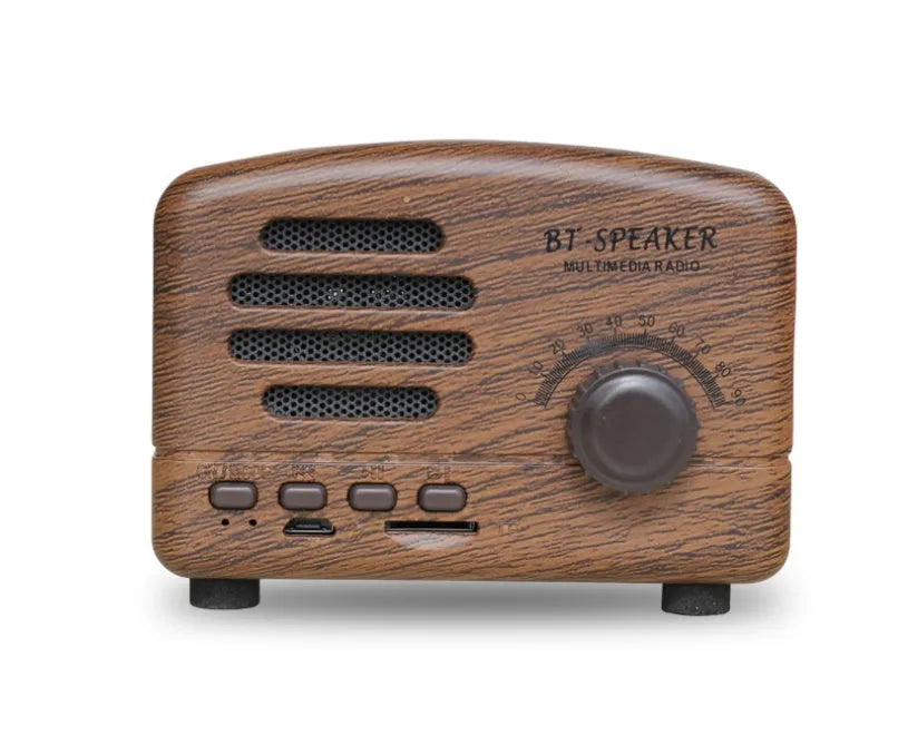 Vintage-style wood-effect Bluetooth speaker in black, pink, and wood grain colour options.