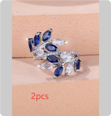 Adjustable copper leaf ring with a zircon stone in a choice of rose gold or platinum finishes.
