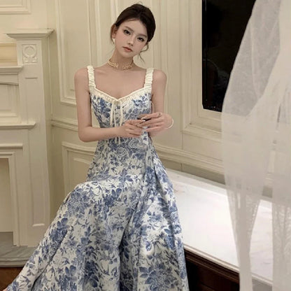 Retro women's floral strap dress in navy blue with high waist and A-line skirt