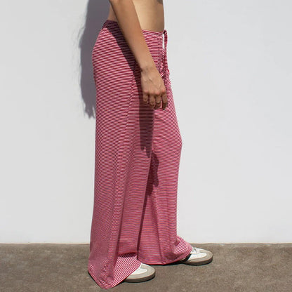 Women's striped print trousers with lace-up detail and wide-leg design in various colours