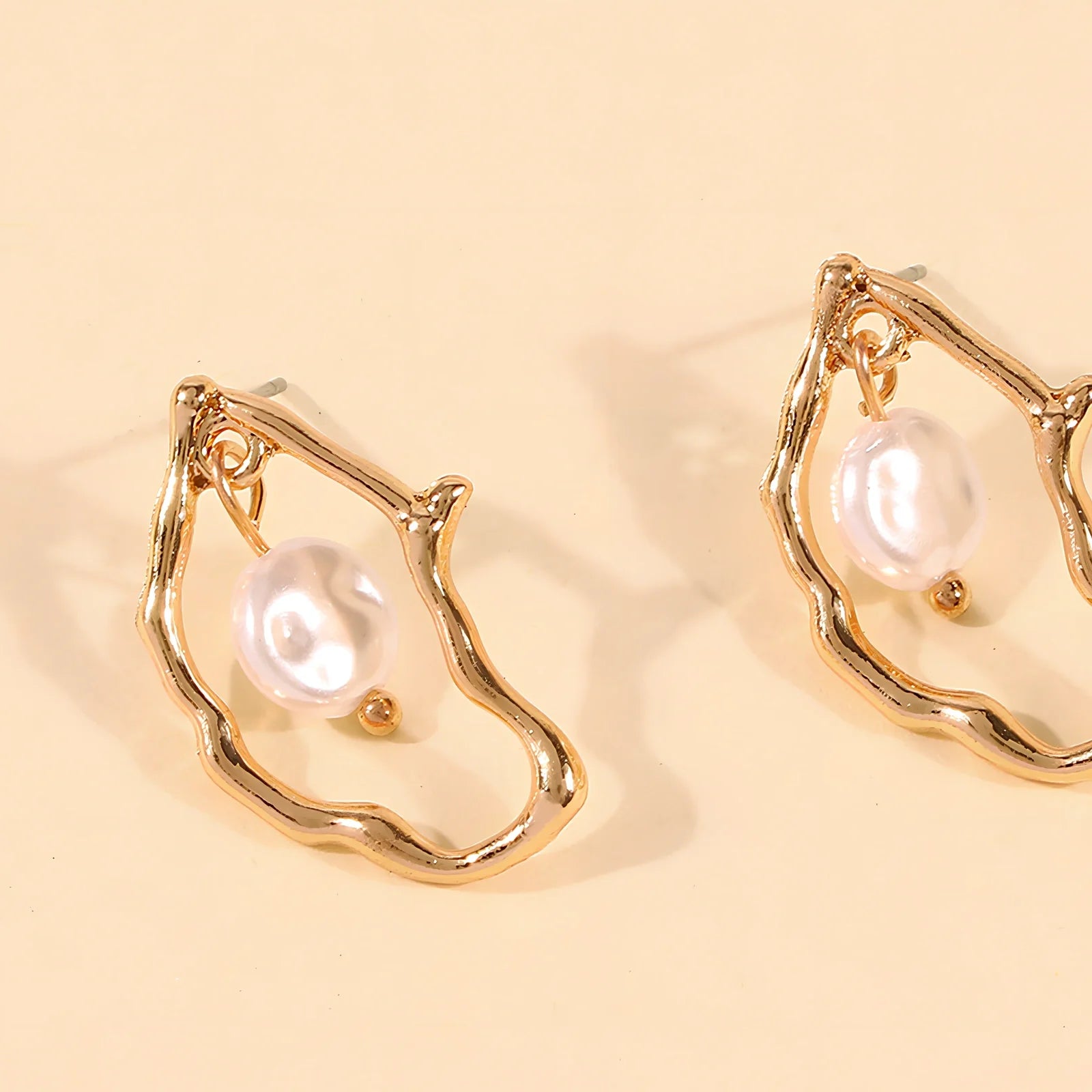Gold alloy irregular pearl earrings with European-American styling for women