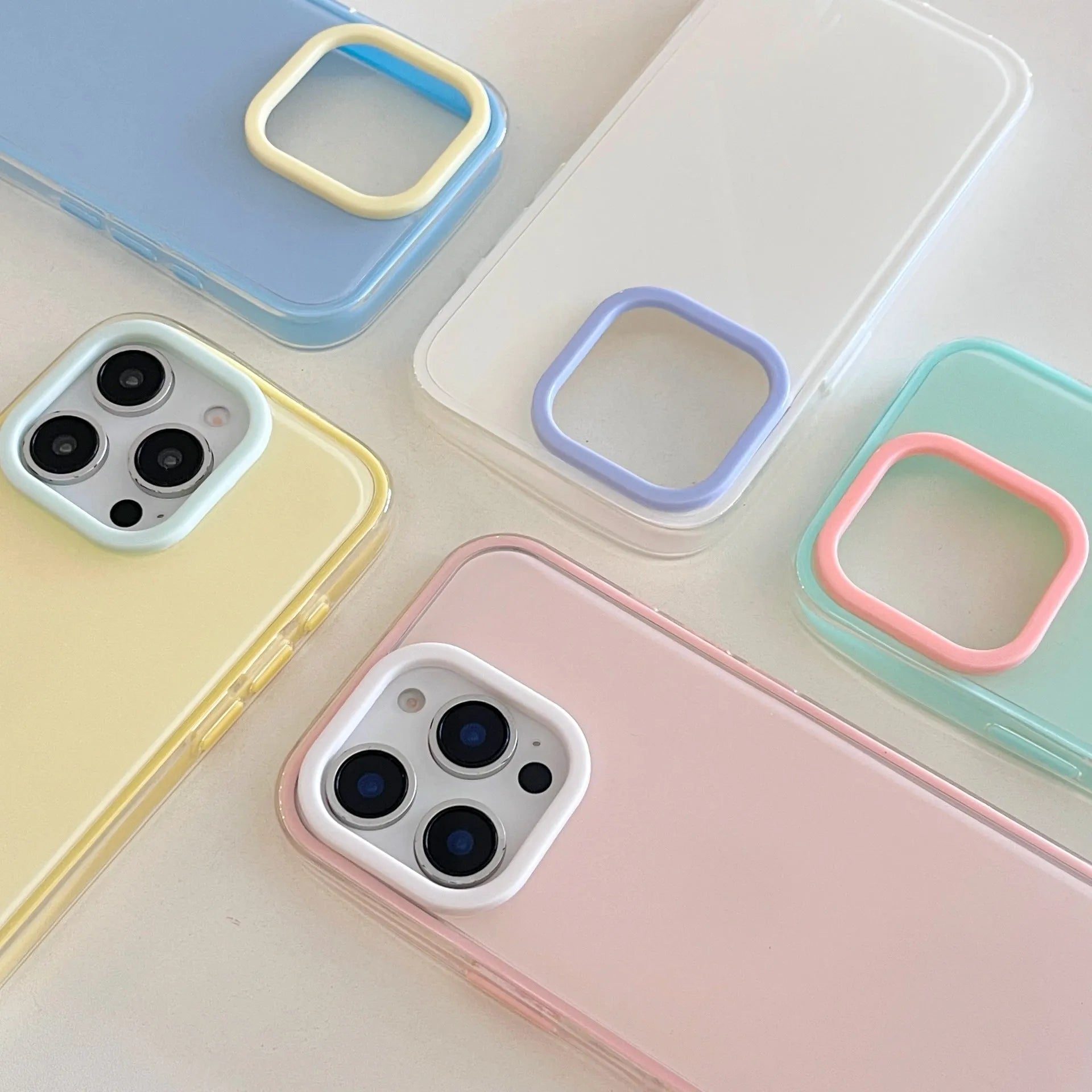 Clear jelly iPhone phone case in solid blue colour on an iPhone, showing bumper-style all-inclusive protection.