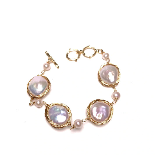 14K gold bracelet with 14mm white button freshwater pearls and baroque texture