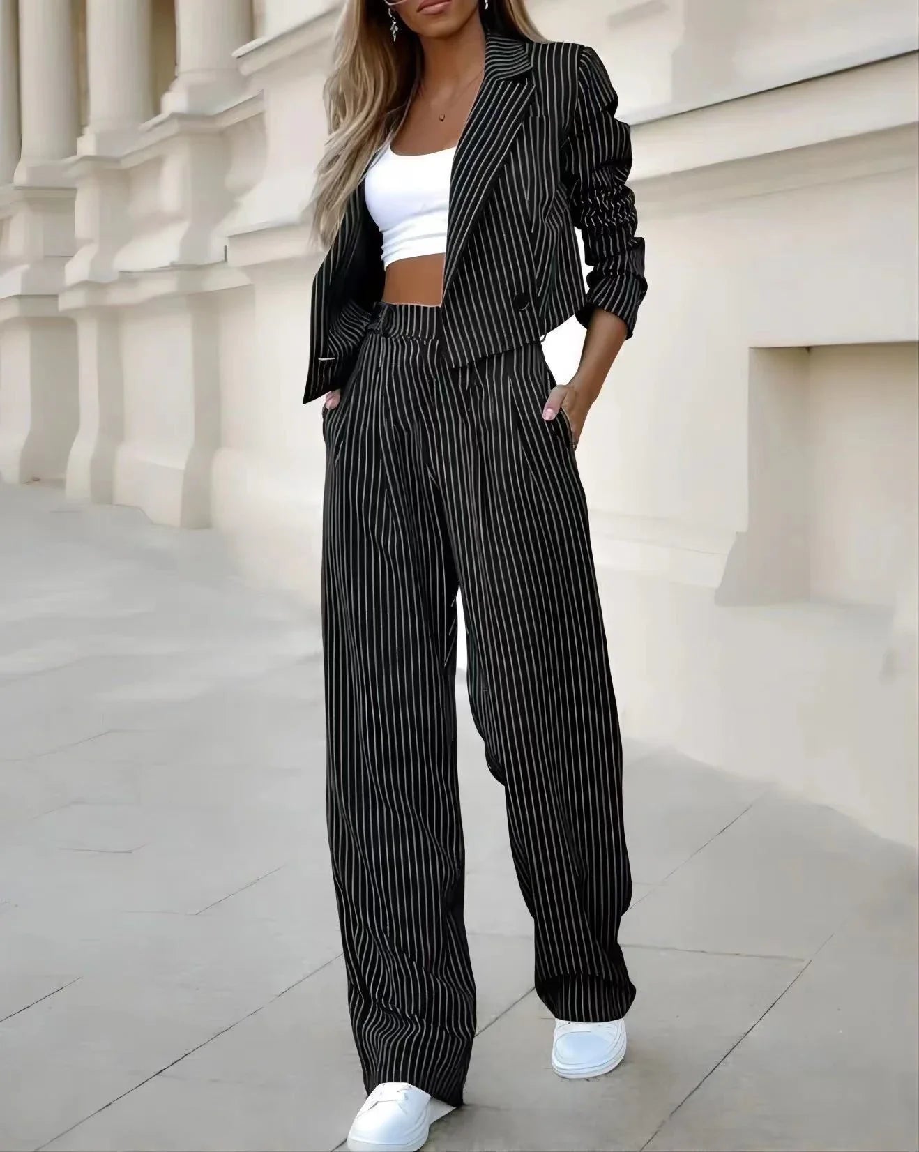 Stylish striped casual suit with cropped top and straight-leg pants in gray, dark blue, and black colors