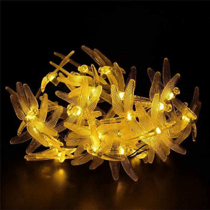 Outdoor solar-powered dragonfly LED string lights with garden spike-mounted panel