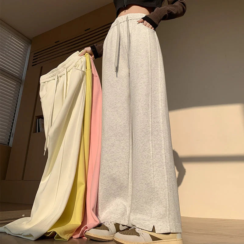 Women's high waist cotton sweatpants in various colours, featuring a straight-leg design and pockets.