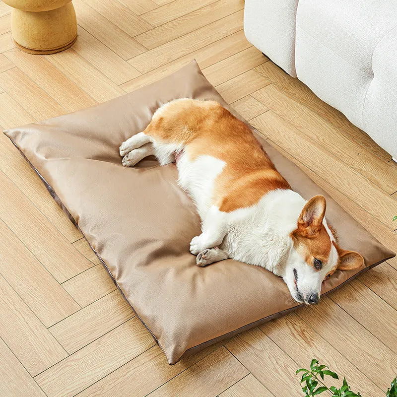 Blue pet bed sleeping mat for cats and small dogs in a nest style with raised edges.