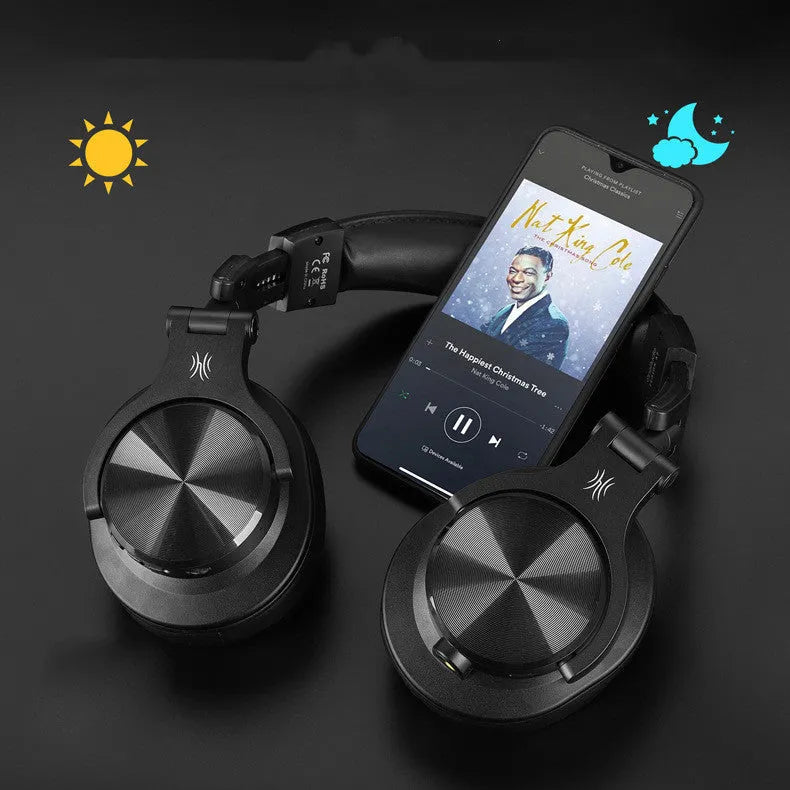 Head-mounted wireless Bluetooth monitor headset in black with 40mm speaker and coiled audio cable