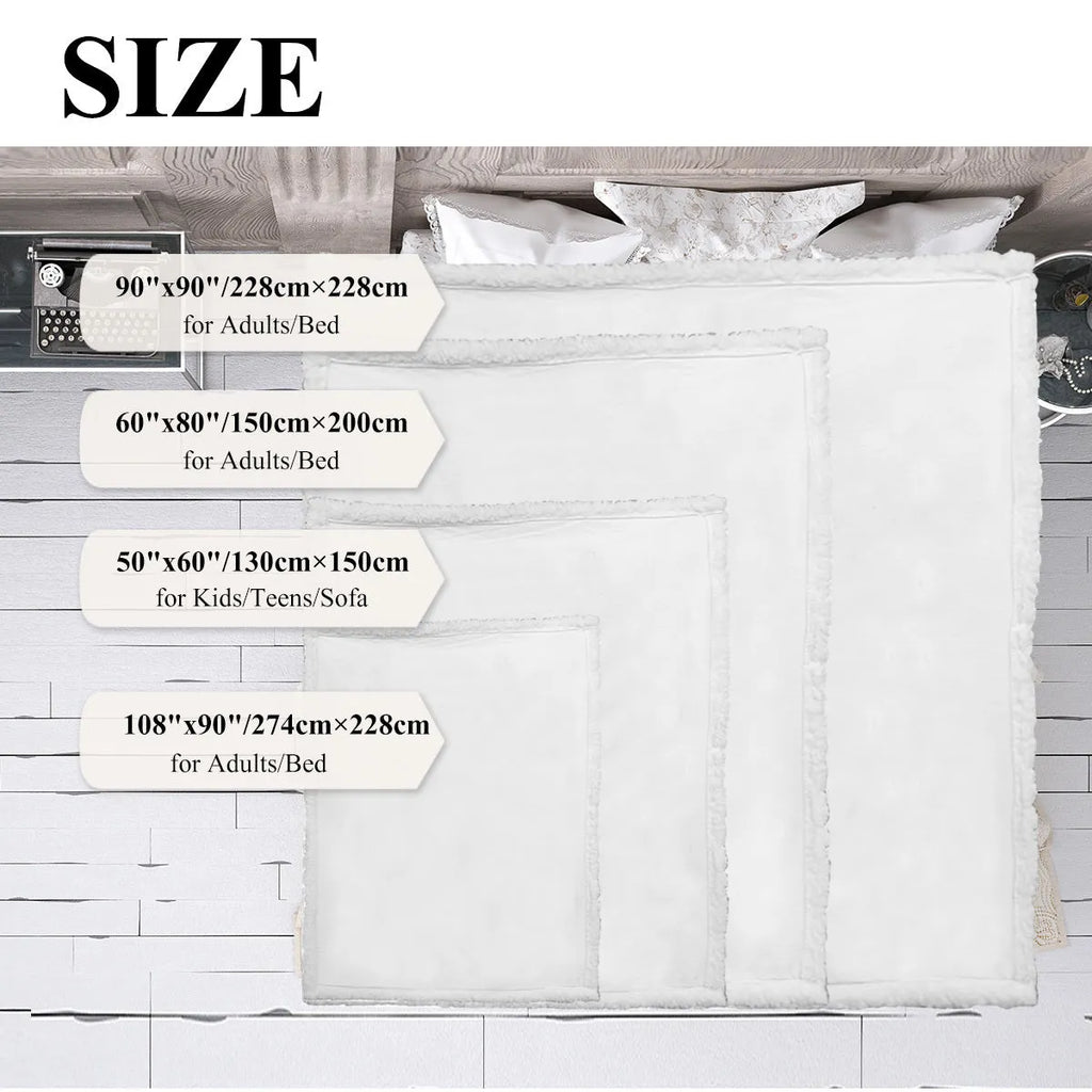 Black sherpa fleece blanket folded on a couch, soft fabric with hemmed edges.