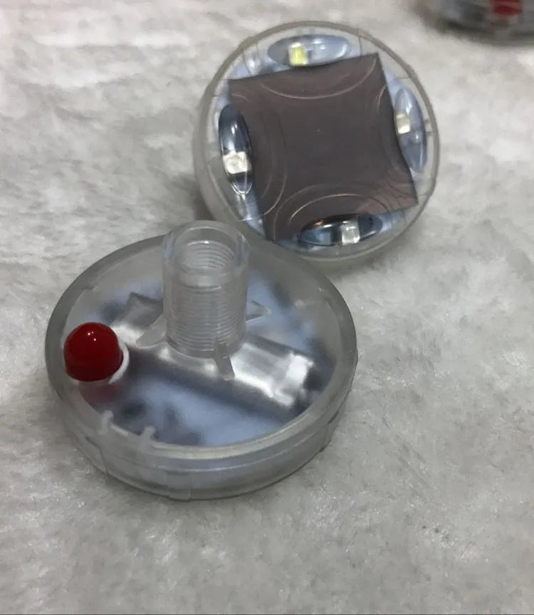 Colourful solar-powered LED hub lights for vehicle wheels with control switch showing multiple flash modes