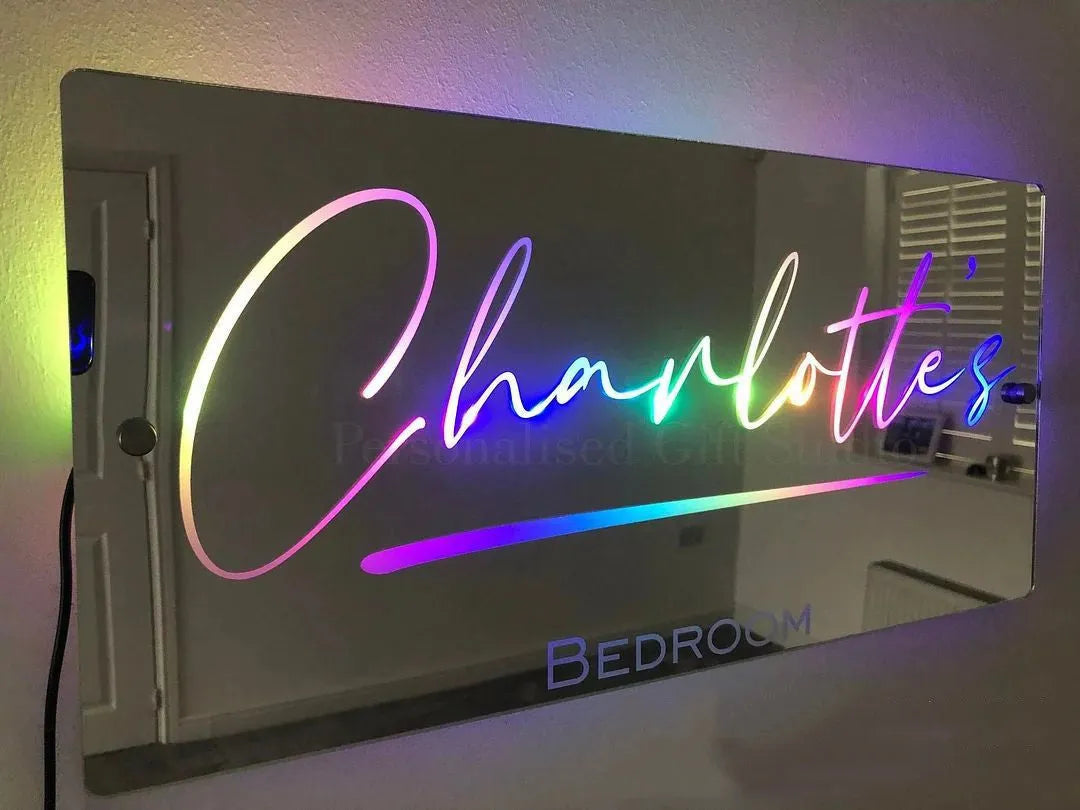 Personalised acrylic name mirror light with LED glow on wall in picture colour