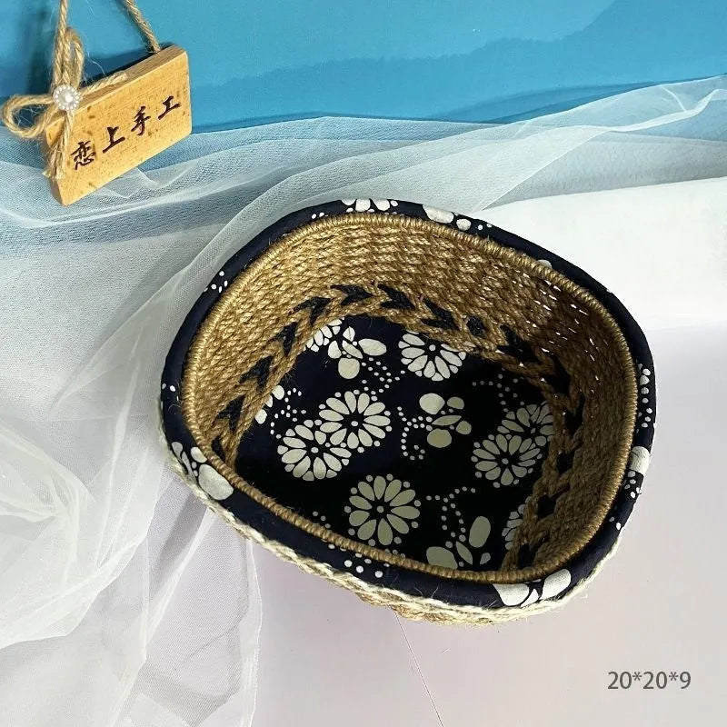 Blue square plastic storage basket with woven texture on a wooden tabletop.