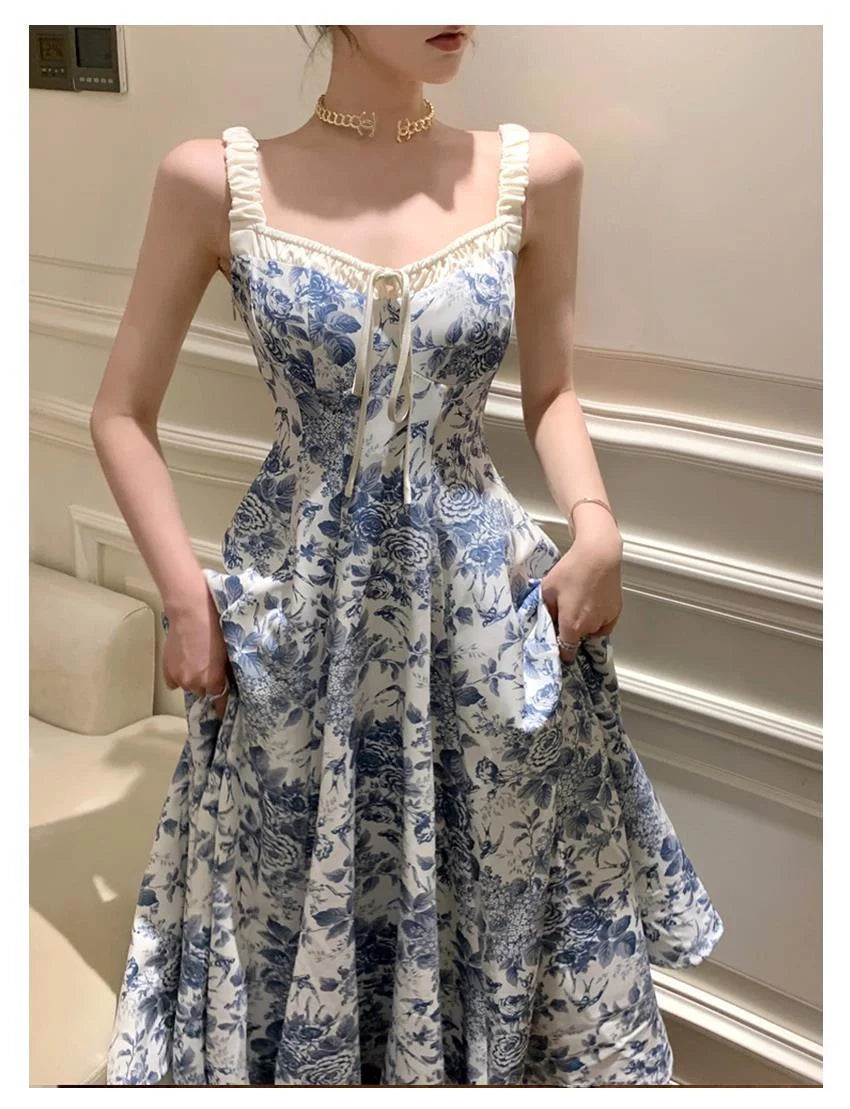 Retro women's floral strap dress in navy blue with high waist and A-line skirt