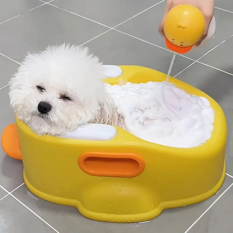 Blue foldable duck-shaped PVC bathtub for washing a dog or cat.