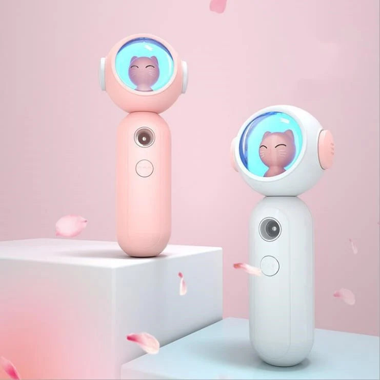 Handheld nano spray steamer in cat pink, cat white, and alien red for skin hydration