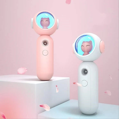 Handheld nano spray steamer in cat pink, cat white, and alien red for skin hydration