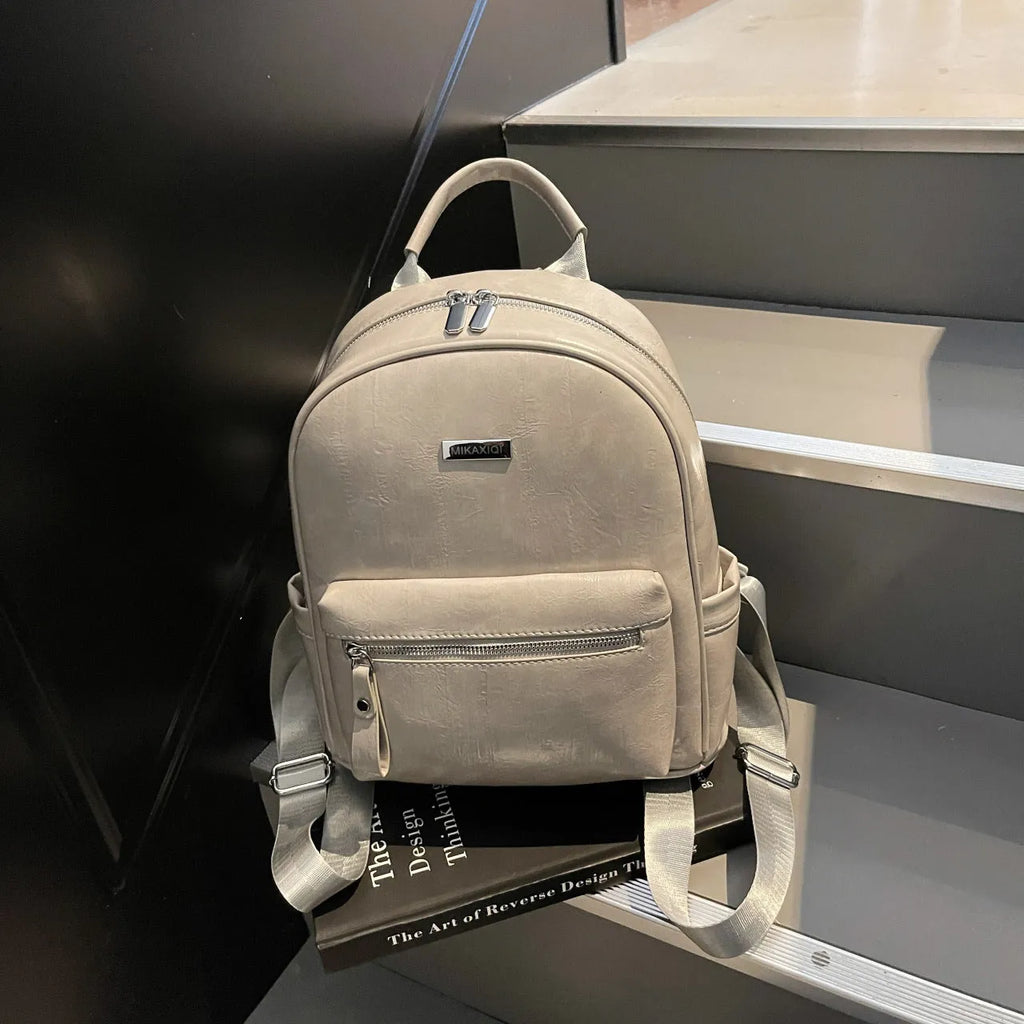 Ladies travel backpack in urban simplicity style, soft PU material, waterproof, with sandwich pocket