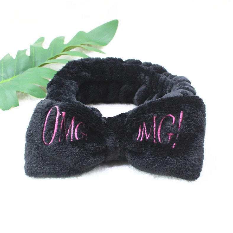 Coral velvet butterfly end hair band in pink with text styling, showing butterfly ends and cloth material