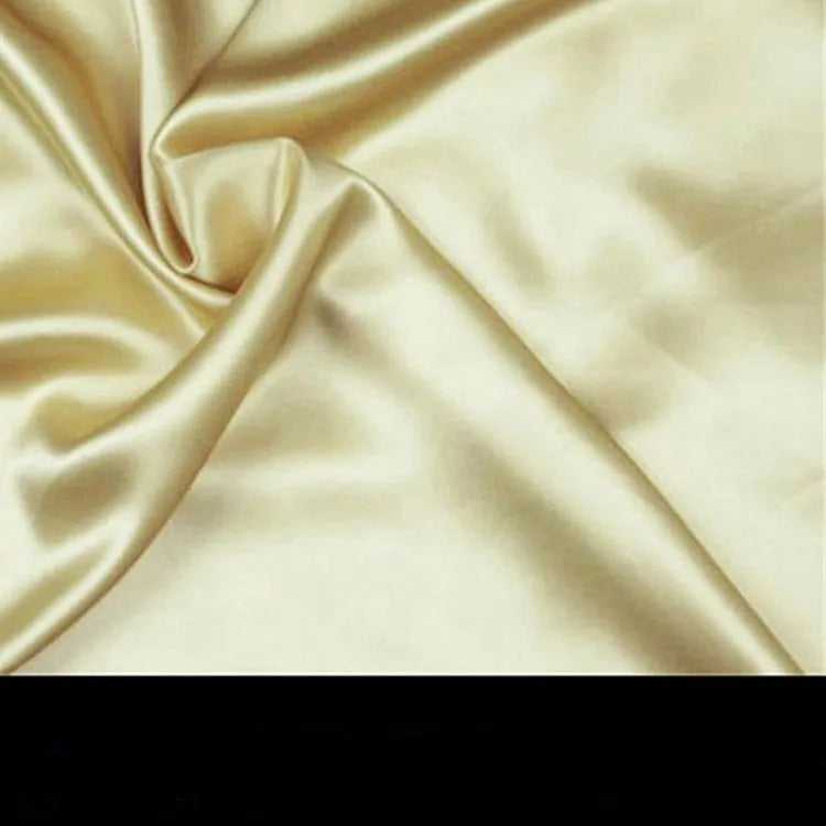 19 M double-sided silk pillowcase shown in one of 14 colours, including apricot, champagne, and navy blue.