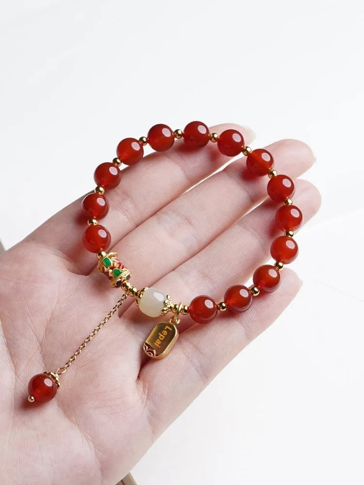 Women's red agate and Hetian jade bracelet with gold plating showing single circle, double circle, and happy ankang styles.