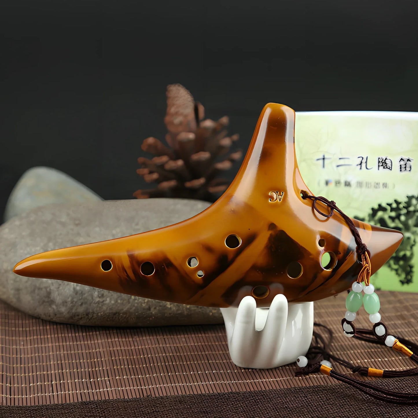 Yellow 12-hole ceramic ocarina in Alto C with 13-note range and integrated lanyard