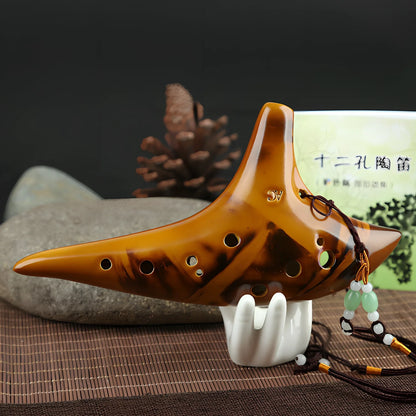 Yellow 12-hole ceramic ocarina in Alto C with 13-note range and integrated lanyard