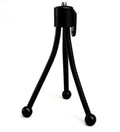 Compact silver metal mini tripod with ball head, shown folded next to an iPhone for scale.