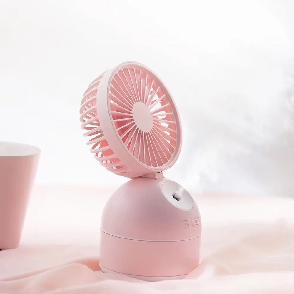 Portable USB fan humidifier in white with cool mist output and integrated fan, placed on a desk