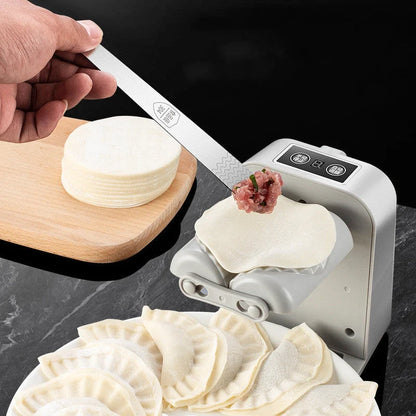 Electric Dumpling Maker Machine on kitchen counter with dumplings
