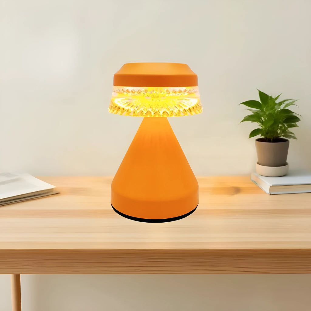 Small black USB rechargeable LED night lamp with electrodeless dimming on a wooden surface.