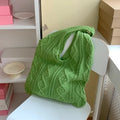 Retro hollow knitted woolen shoulder tote bag in a solid colour with double straps, shown flat displaying its large size.