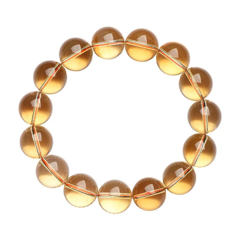 Natural citrine scattered beads ball bracelet in 7A grade colour on a wrist.