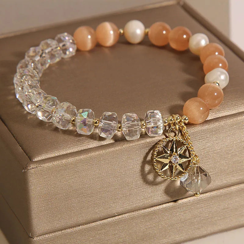 Orange eight Awn star bracelet with gold-plated inlaid gemstones showing detailed design