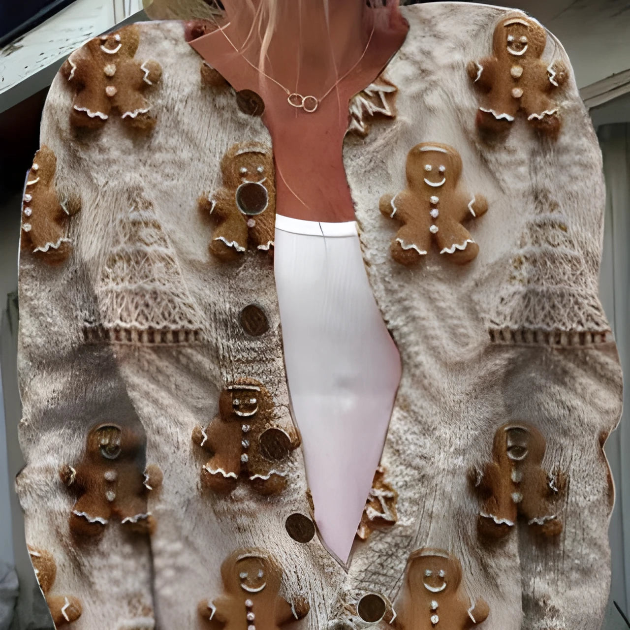 Loose-fit digital printed top with lapel collar in assorted sizes on a hanger.