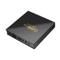 Q96 MAX S905 Android 4K TV Box streaming media player with remote control and accessories on a wooden table.