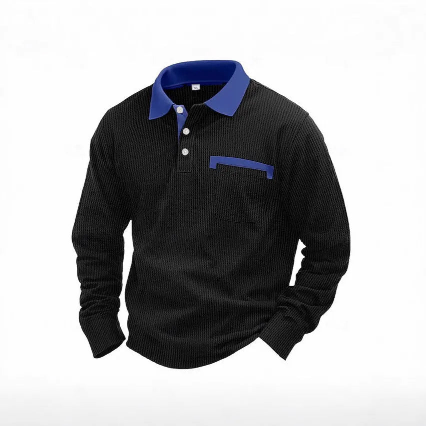 Man wearing a loose-fit long-sleeved waffle-texture polo shirt in a dark colour.