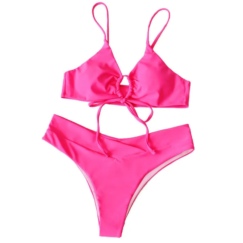 Women's orange bikini swimsuit with tied bow top and briefs bottom on a mannequin