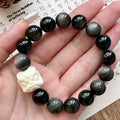 Obsidian prayer beads bracelet with manual processing and chamfered square grain details
